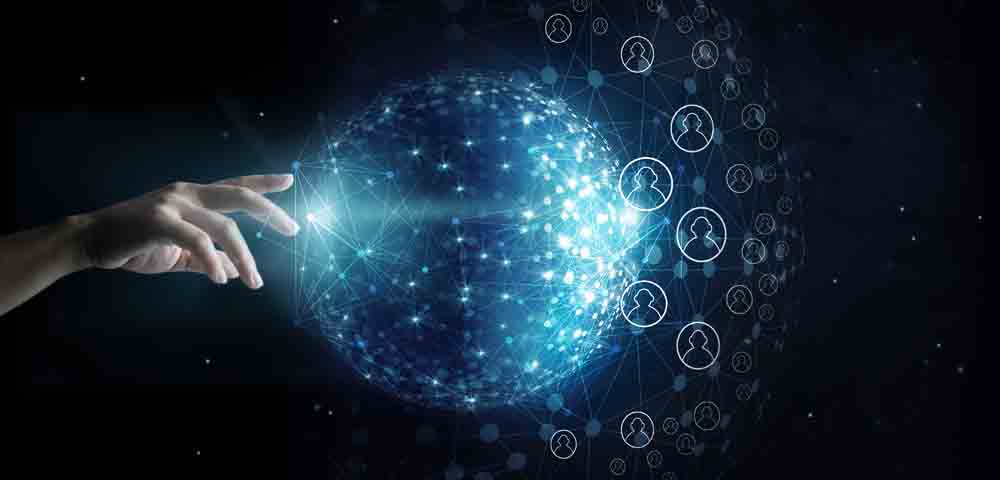 A hand with a holographic image of the globe with various sets of data.