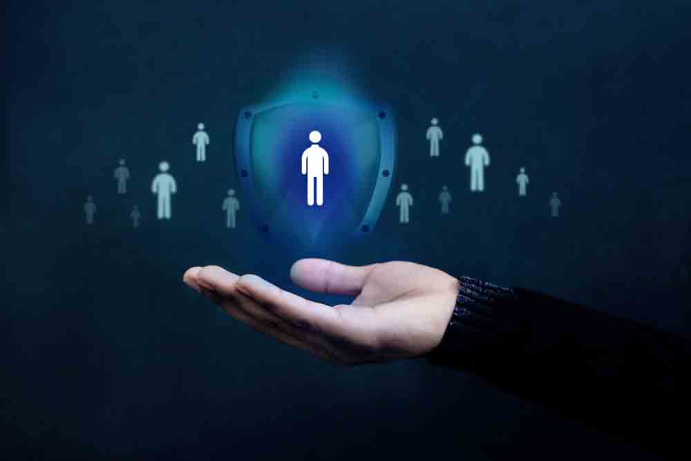 A hand with a holographic image of people on the palm