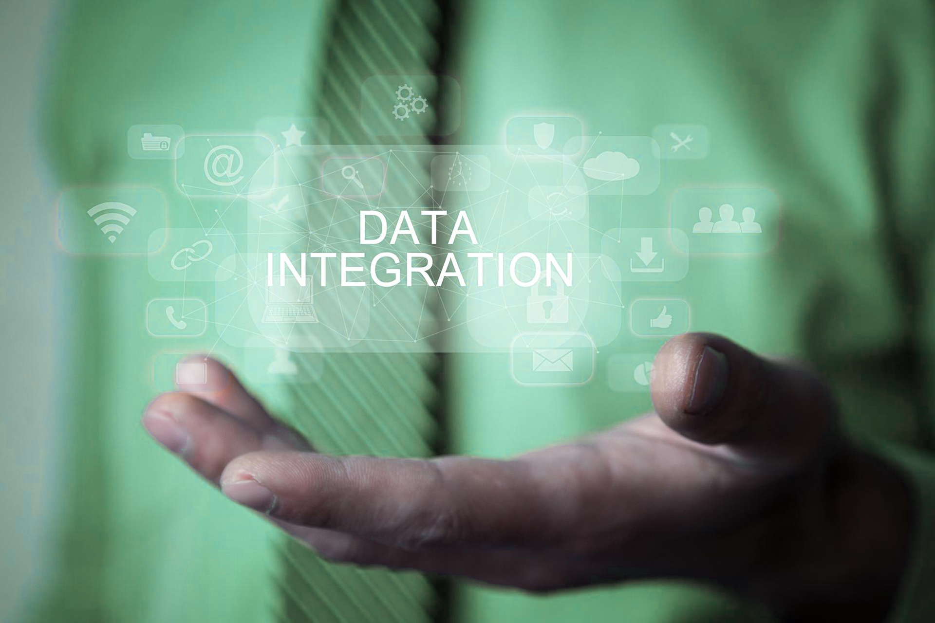 A businessman pointing at digital gears symbolizing ERP data integration