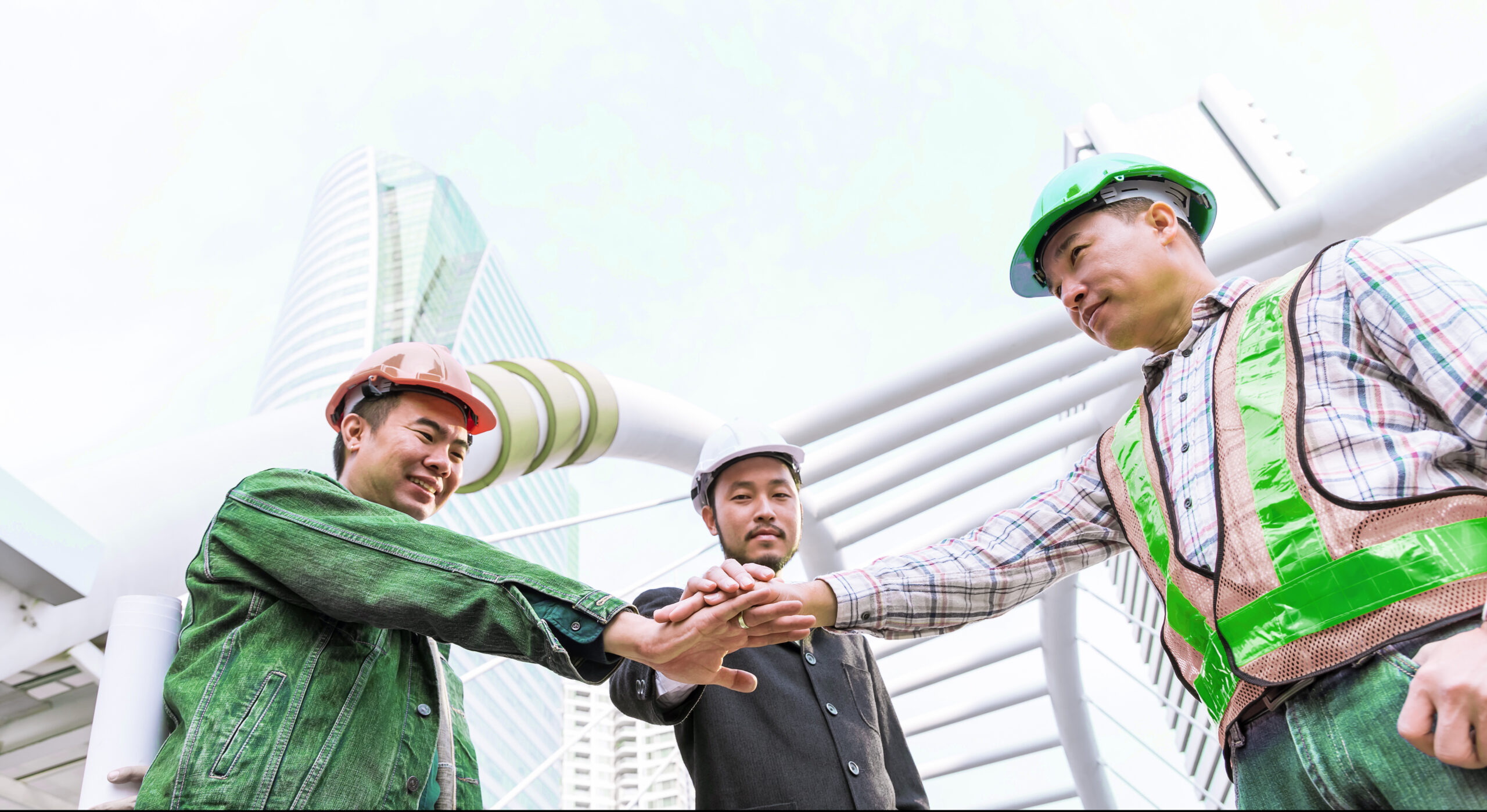 Employees in different uniforms represent how HR software for construction connects workforce