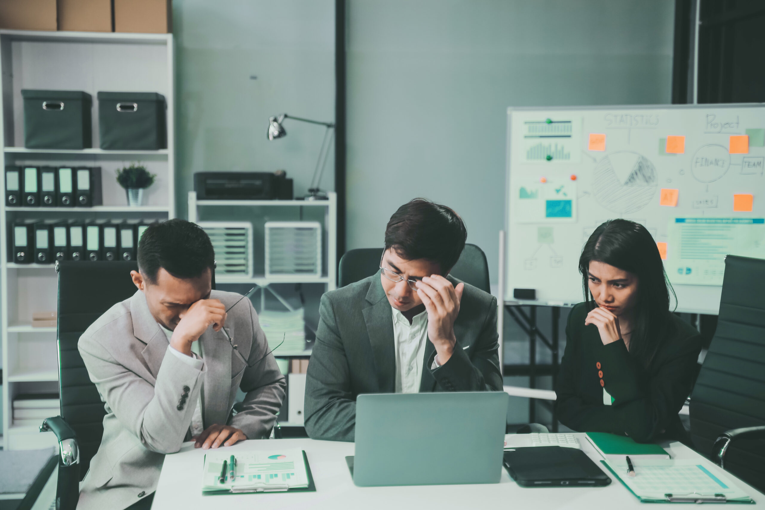 Frustrated employees facing difficulties with government compliance challenges