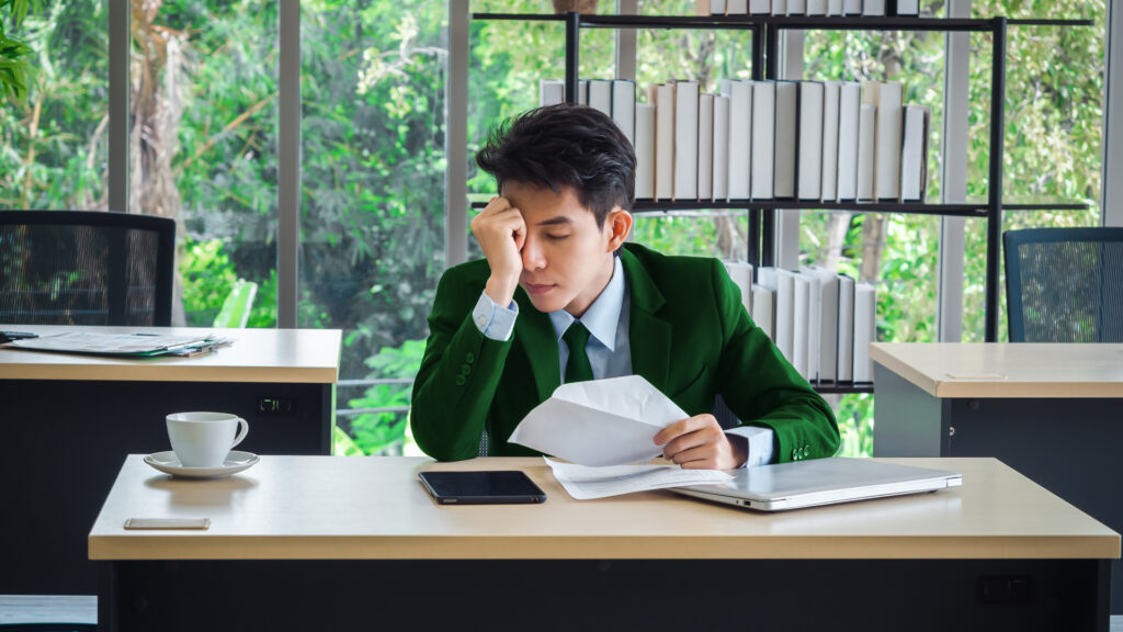 Stressed employee struggling with workload management