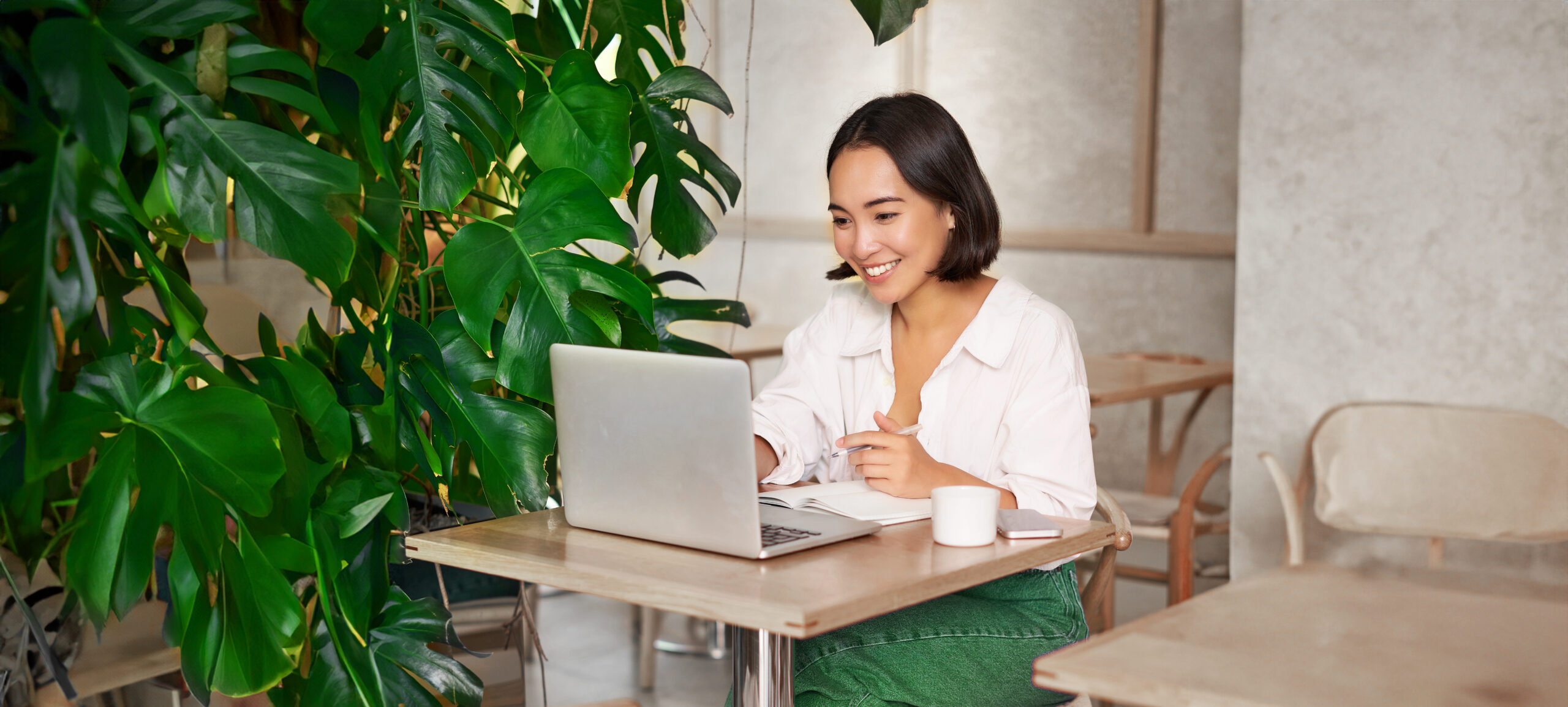 Employee smiling and efficiently managing tasks with the Lark superapp.